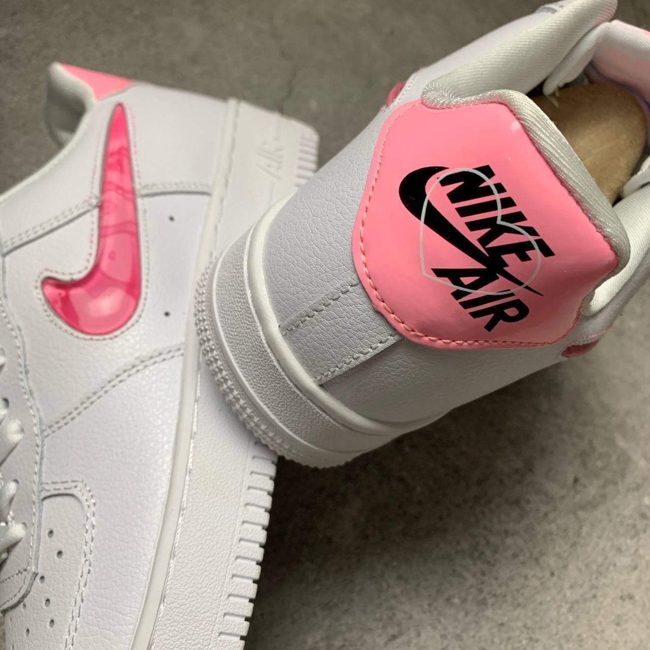 Nike air force ones with pink swoosh hotsell